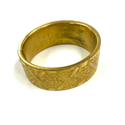 569 - Victorian gilt metal bangle in original fitted case