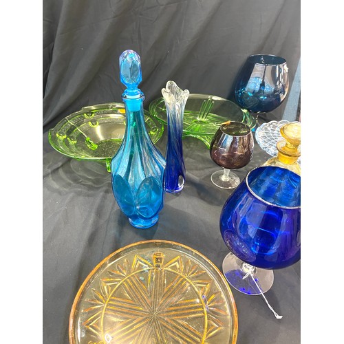 897 - Large selection of coloured glassware includes decanters etc