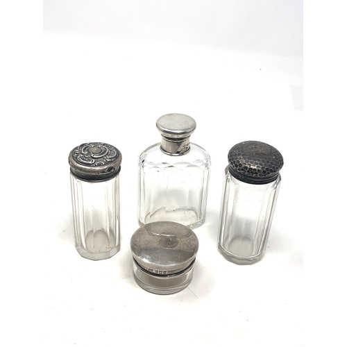 24 - 4 antique silver topped bottles
