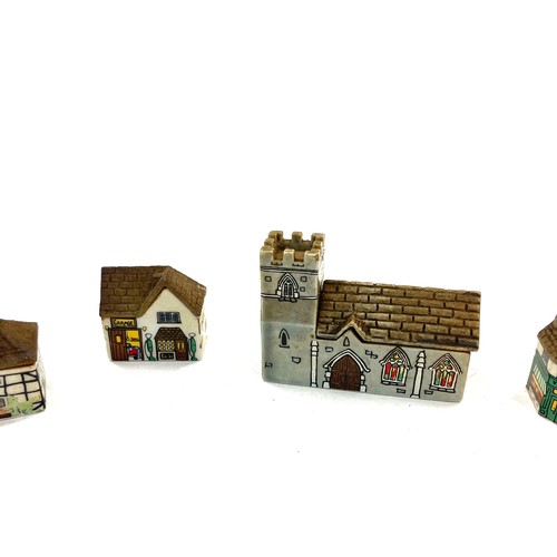 629 - Selection of vintage Wade village miniatures, to include St Sebastin Church, Flower shop etc