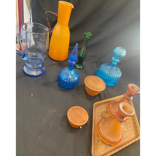 894 - Large selection of coloured glassware includes decanters, dressing table set etc