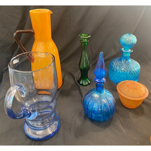 894 - Large selection of coloured glassware includes decanters, dressing table set etc