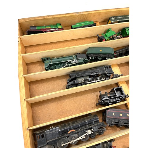 785 - Showcase containing various train engines to include Duchess of Montrose, Victoria, LMS 7606,  Winds... 