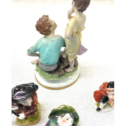 597 - Selection vintage Capodimonte figurines markers mark to base, damage to largest figure (finger)