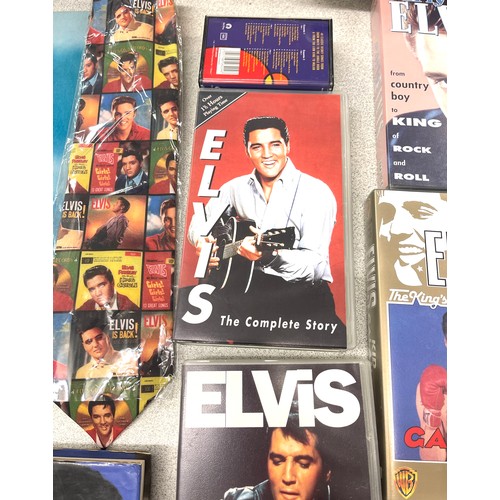 899 - Selection Elvis memorbillia to include CD's, Videos, wall plaques, tie etc