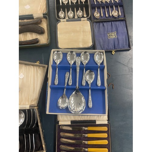 801 - Large selection of silver plated cased fruit spoon sets, carving set etc