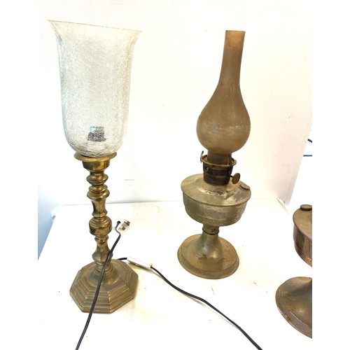 704 - 2 Vintage oil lamps together with a glass shade electric lamp, untested