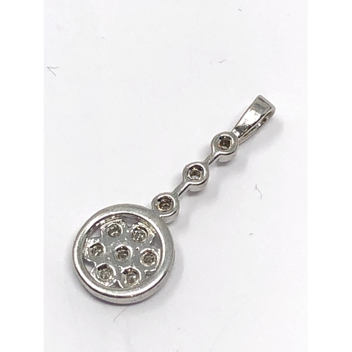 94 - 9ct white gold diamond pendant measures approx 2.4cm drop weight 1.3g