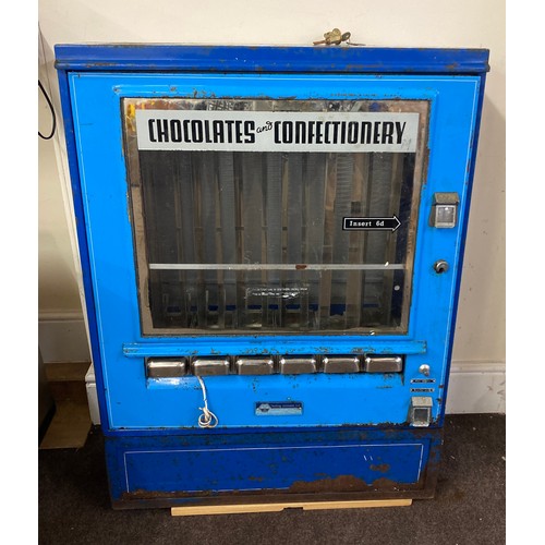 Vintage chocolate and confectionery machine with new lock and key measures approx 39 inches tall 30 inches wide 9 inches depth