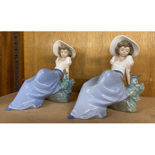 665 - Matching Vintage Nao figures of a girl on a rock with a bird, height 6 inches