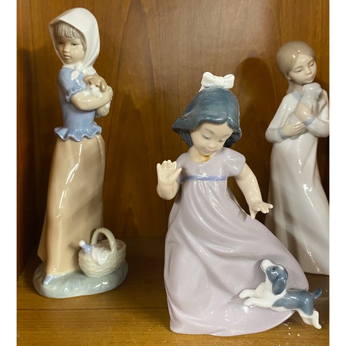 723 - Selection of 3 vintage Nao figures of Girls playing with dogs, tallest measures 8.5 inches tall