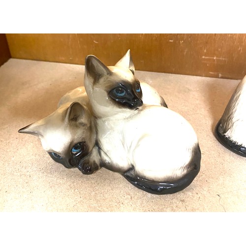 670 - Royal Doulton Siamese sitting cat figurines #1887, 1296 and Royal Doulton sitting cat, all in good o... 