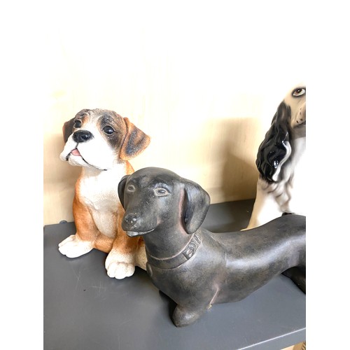 762 - 4 Large dog ornaments to include a Dashound, Boxer, Dalmation, Spaniel