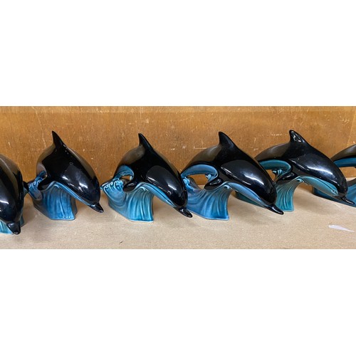 618 - Selection of 6 Poole Pottery swimming Dolphin figures