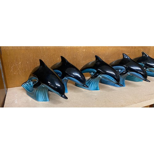 618 - Selection of 6 Poole Pottery swimming Dolphin figures