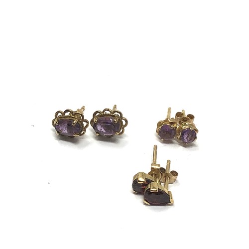 230 - 3 x 9ct gold paired gemstone stud earrings inc. amethyst & garnet (2.2g)