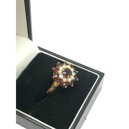 227 - 9ct gold vintage garnet & opal double halo dress ring (3.2g)