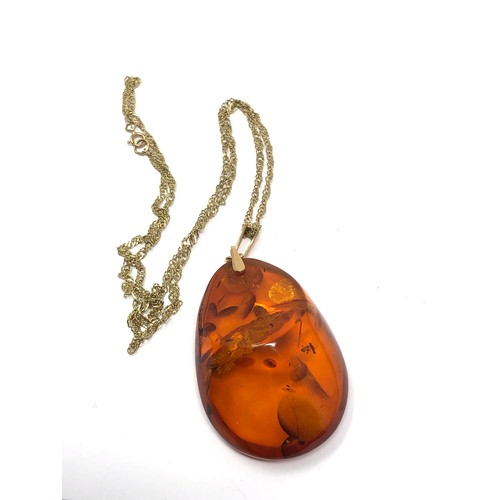 303 - 14ct gold bail baltic amber pendant on 9ct gold chain (11.6g)