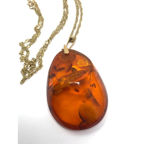 303 - 14ct gold bail baltic amber pendant on 9ct gold chain (11.6g)