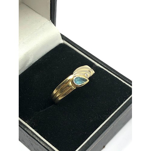 217 - 9ct yellow and white gold blue topaz & diamond stylised wing ring (2.7g)