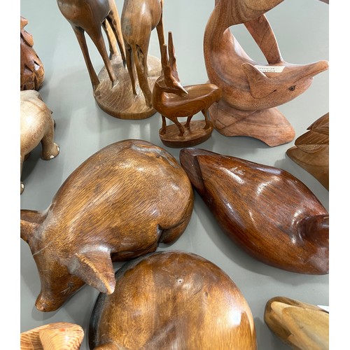 640 - Large selection carved wooden animal / mammal ornaments to include giraffe, duck, dolphin etc