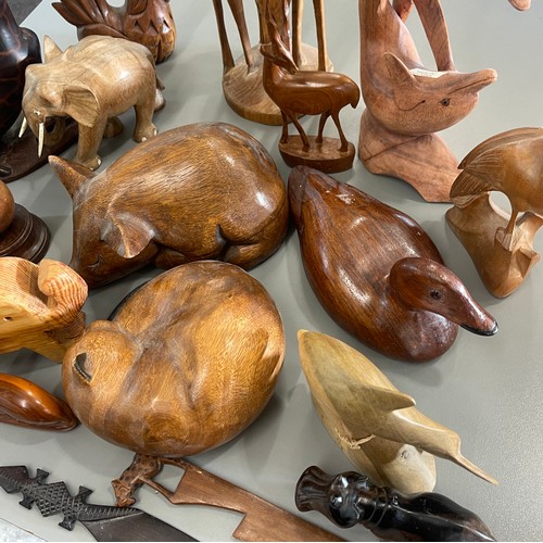 640 - Large selection carved wooden animal / mammal ornaments to include giraffe, duck, dolphin etc