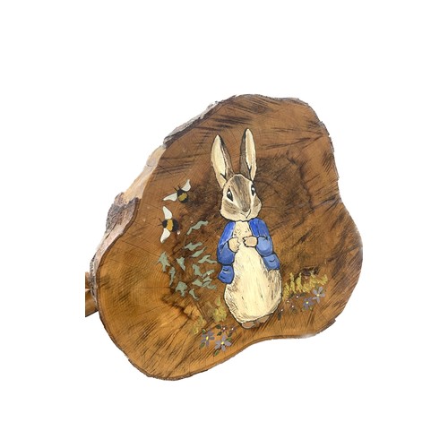 768 - Hand painted peter Rabbit log slice measures approx 15 inches tall 17 inches wide