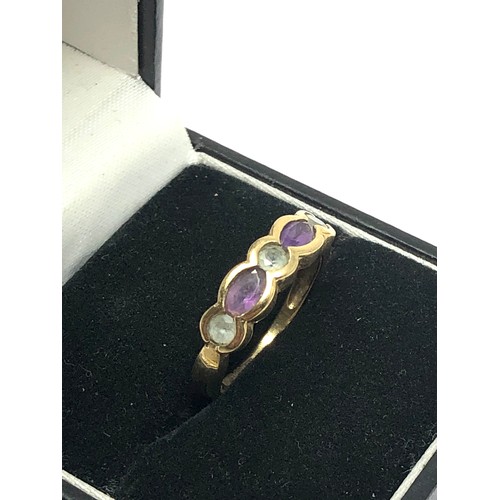 298 - 9ct gold blue topaz & amethyst gypsy setting dress ring (2g)