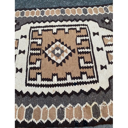 945 - Camel hair rug measures approx 19 inches long by 65 inches wide