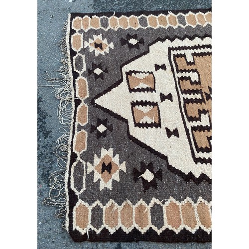 945 - Camel hair rug measures approx 19 inches long by 65 inches wide