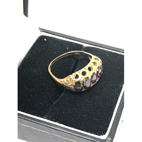 248 - 9ct gold garnet five stone gypsy setting ring (2.3g)