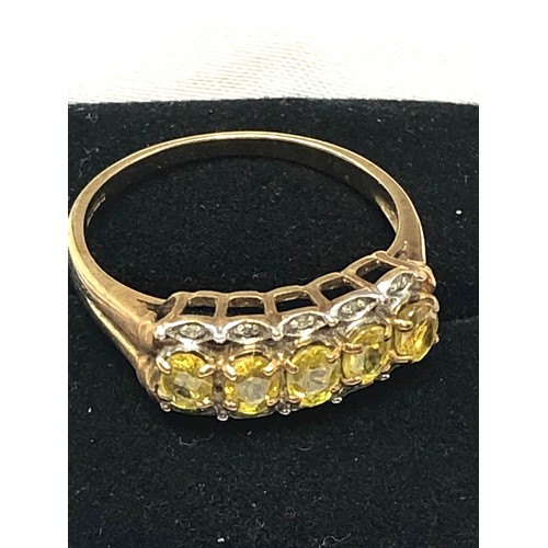 240 - 9ct gold yellow sapphire five stone ring with diamond accents (2.7g)