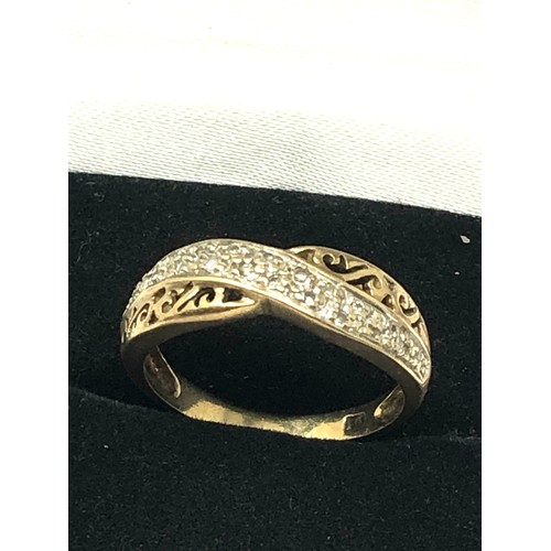 258 - 9ct gold diamond crossover ring with openwork detail (2.5g)