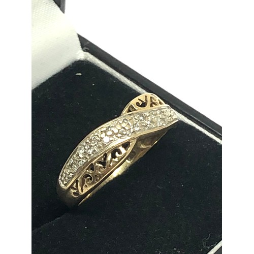 258 - 9ct gold diamond crossover ring with openwork detail (2.5g)