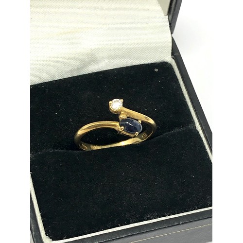 152 - 14ct gold sapphire set bypass ring (1.5g)