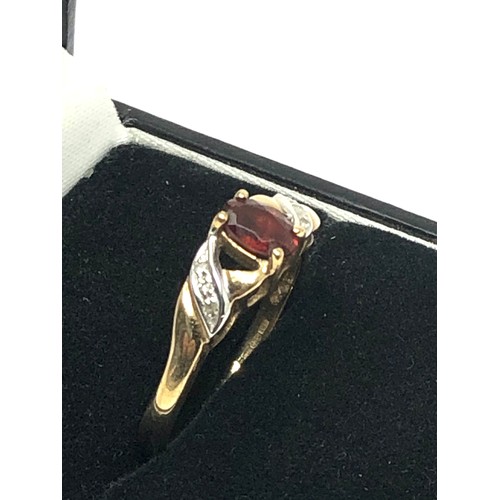 176 - 9ct gold garnet and diamond set dress ring (2.1g)