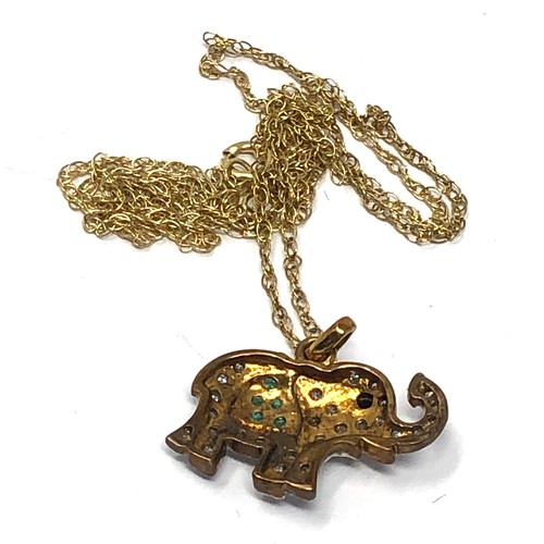 163 - 9ct gold sapphire diamond and emerald set elephant pendant necklace (2.6g)