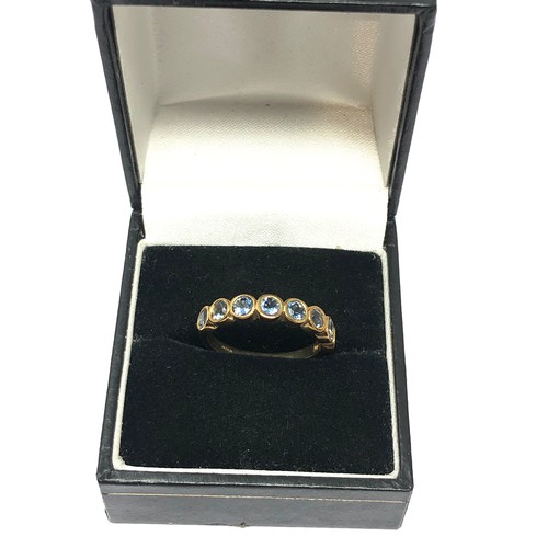 121 - 9ct gold aquamarine half eternity ring (2.3g)