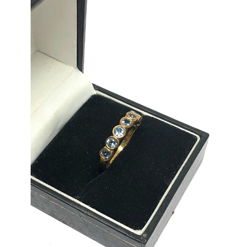 121 - 9ct gold aquamarine half eternity ring (2.3g)