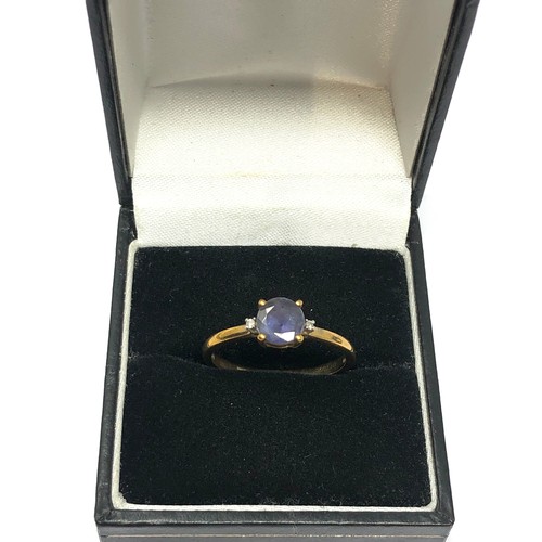 190 - 9ct gold diamond accented tanzanite set ring (1.7g)