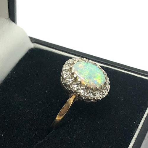 162 - 9ct gold opal & diamond halo dress ring (2.8g)