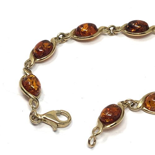 173 - 9ct gold baltic amber set twist link bracelet (6.8g)