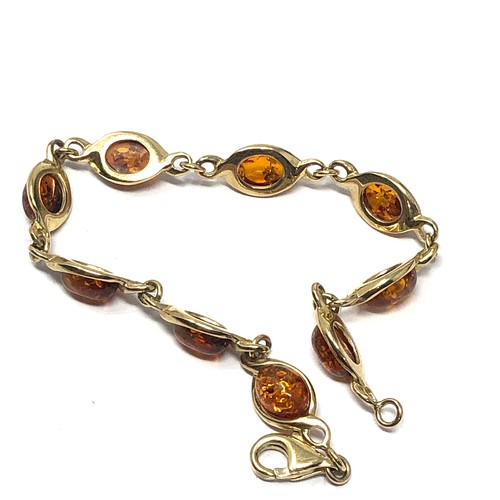 173 - 9ct gold baltic amber set twist link bracelet (6.8g)