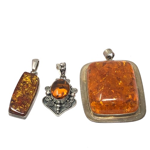 359 - 3 x .925 amber set pendants including suarti (69g)