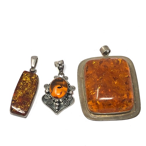 359 - 3 x .925 amber set pendants including suarti (69g)