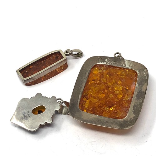 359 - 3 x .925 amber set pendants including suarti (69g)