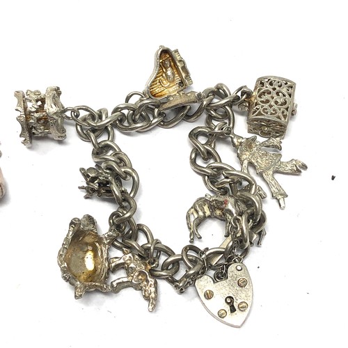 332 - .925 vintage charm bracelet with assorted charms (79g)