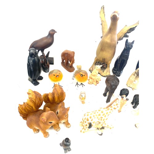 737 - Large selection of dog figures includes Carved wooden, plastic, egyptian cats etc