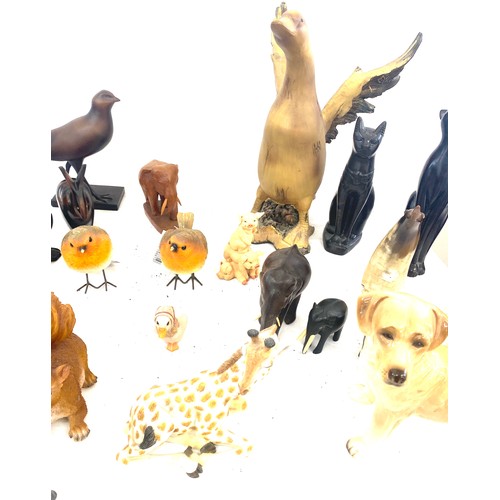 737 - Large selection of dog figures includes Carved wooden, plastic, egyptian cats etc