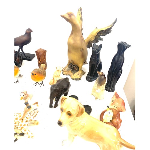 737 - Large selection of dog figures includes Carved wooden, plastic, egyptian cats etc